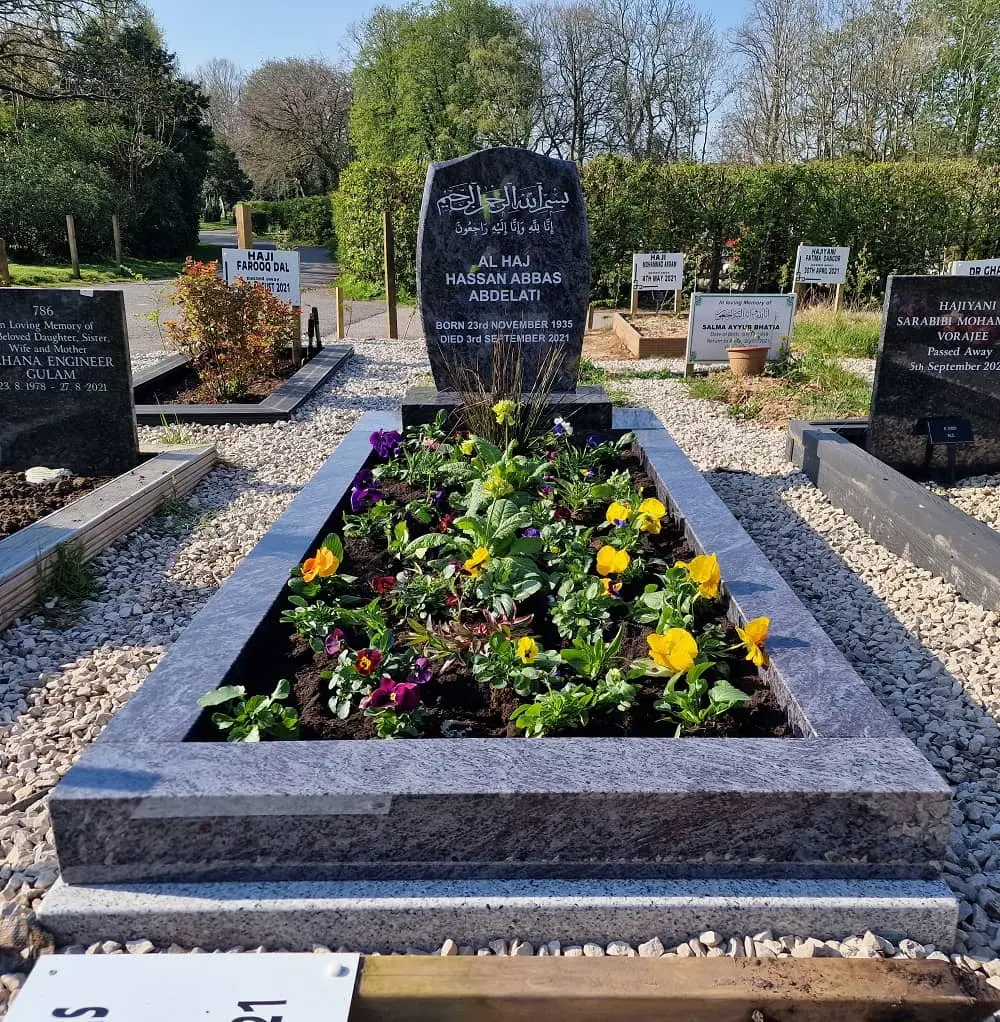 Flowers within an existing Al Nour memorial surround